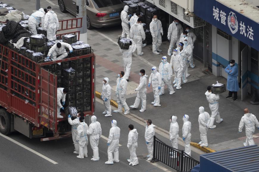 Chinese people in queue to distribute PPEs