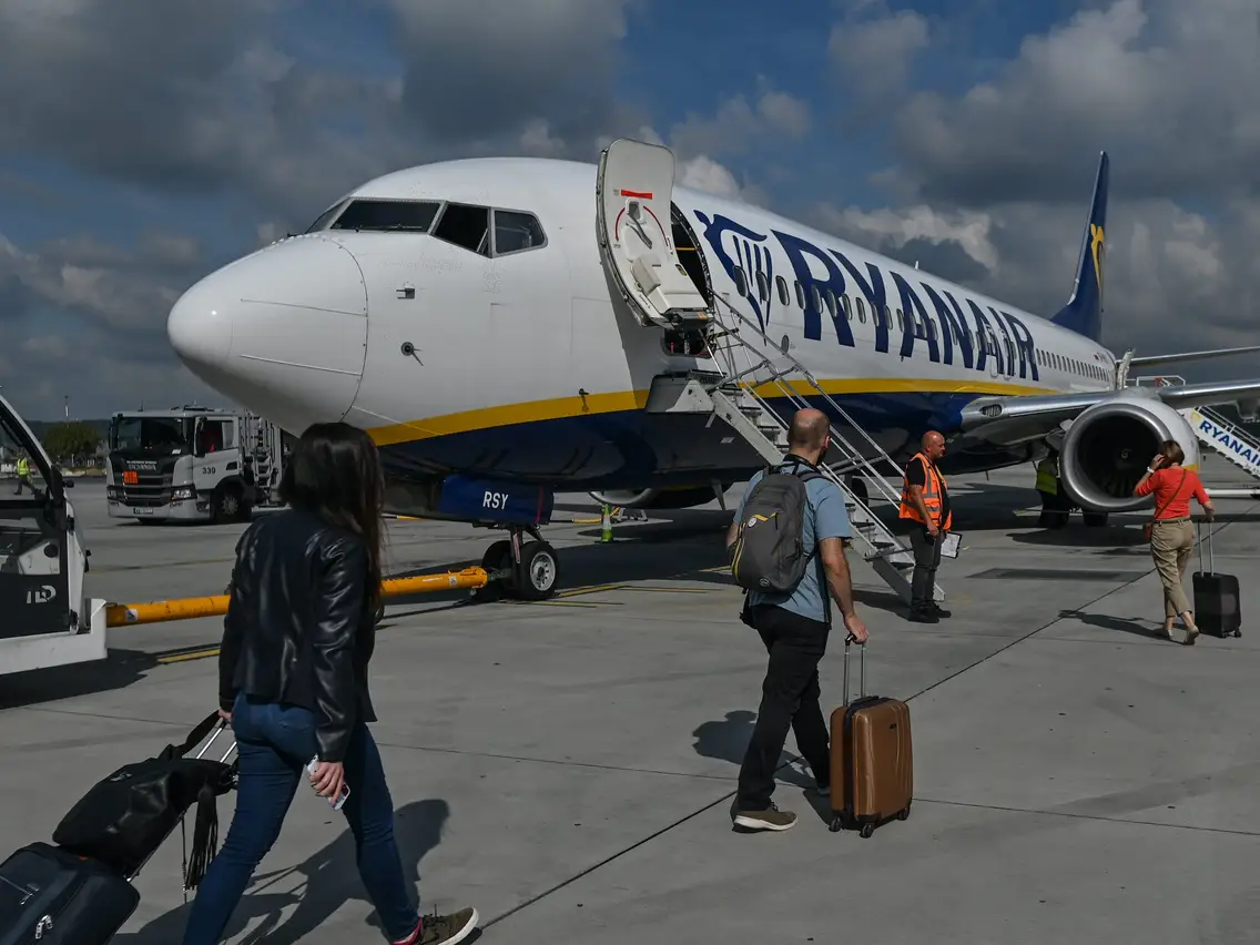 Passengers board a Ryanair flight in Krakow, Poland.