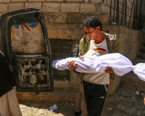 A person carrying a dead body of child