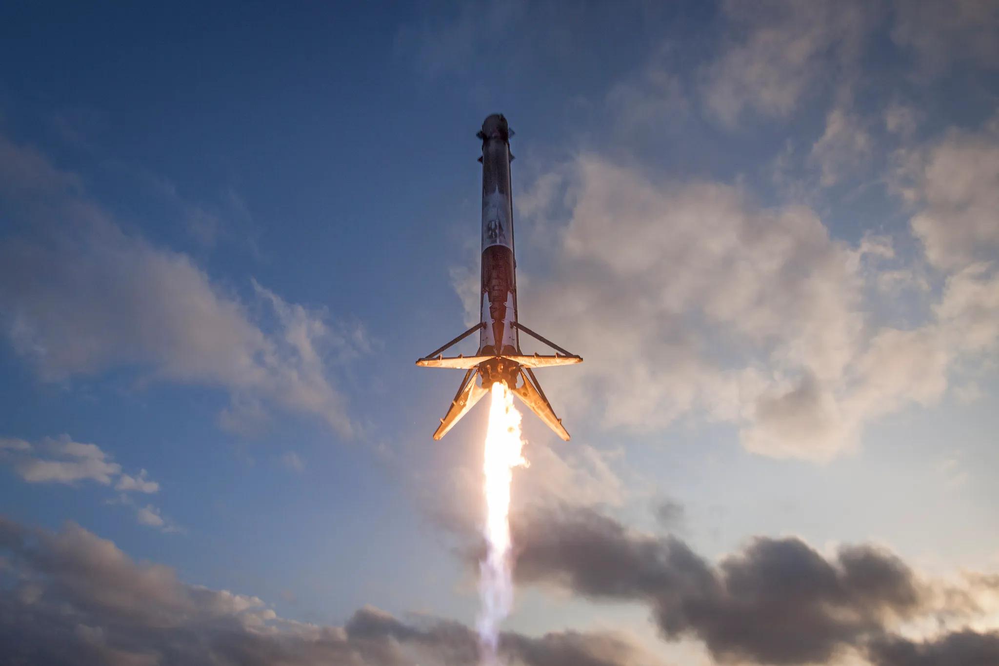 Engineers inspecting reusable rocket technology launch pad after explosion damage