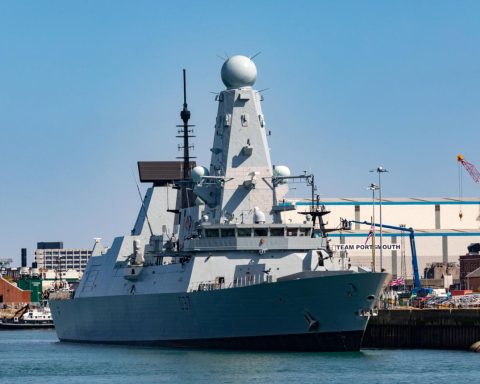 Royal Navy warship undergoing technical inspection in Portsmouth UK