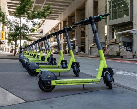 Mobility startup Lime electric scooters lined up in a downtown US street before the 2026 IPO