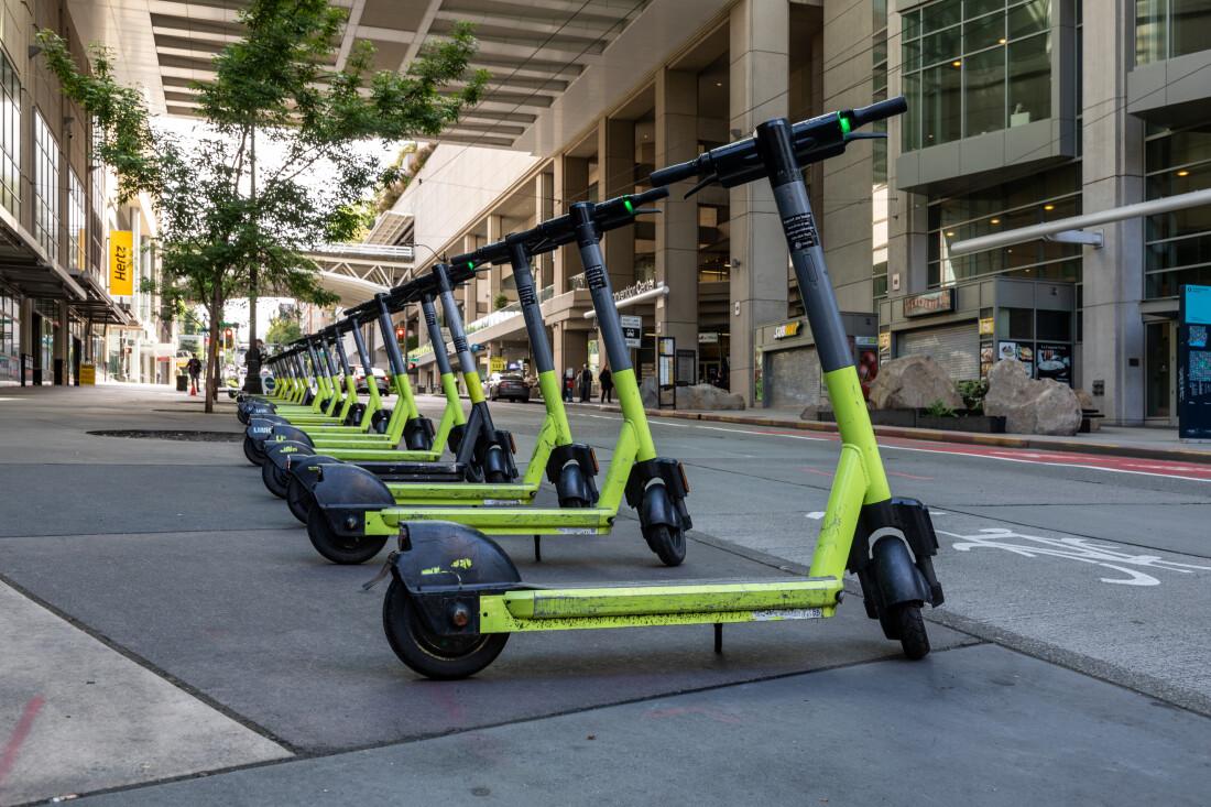 Mobility startup Lime electric scooters lined up in a downtown US street before the 2026 IPO