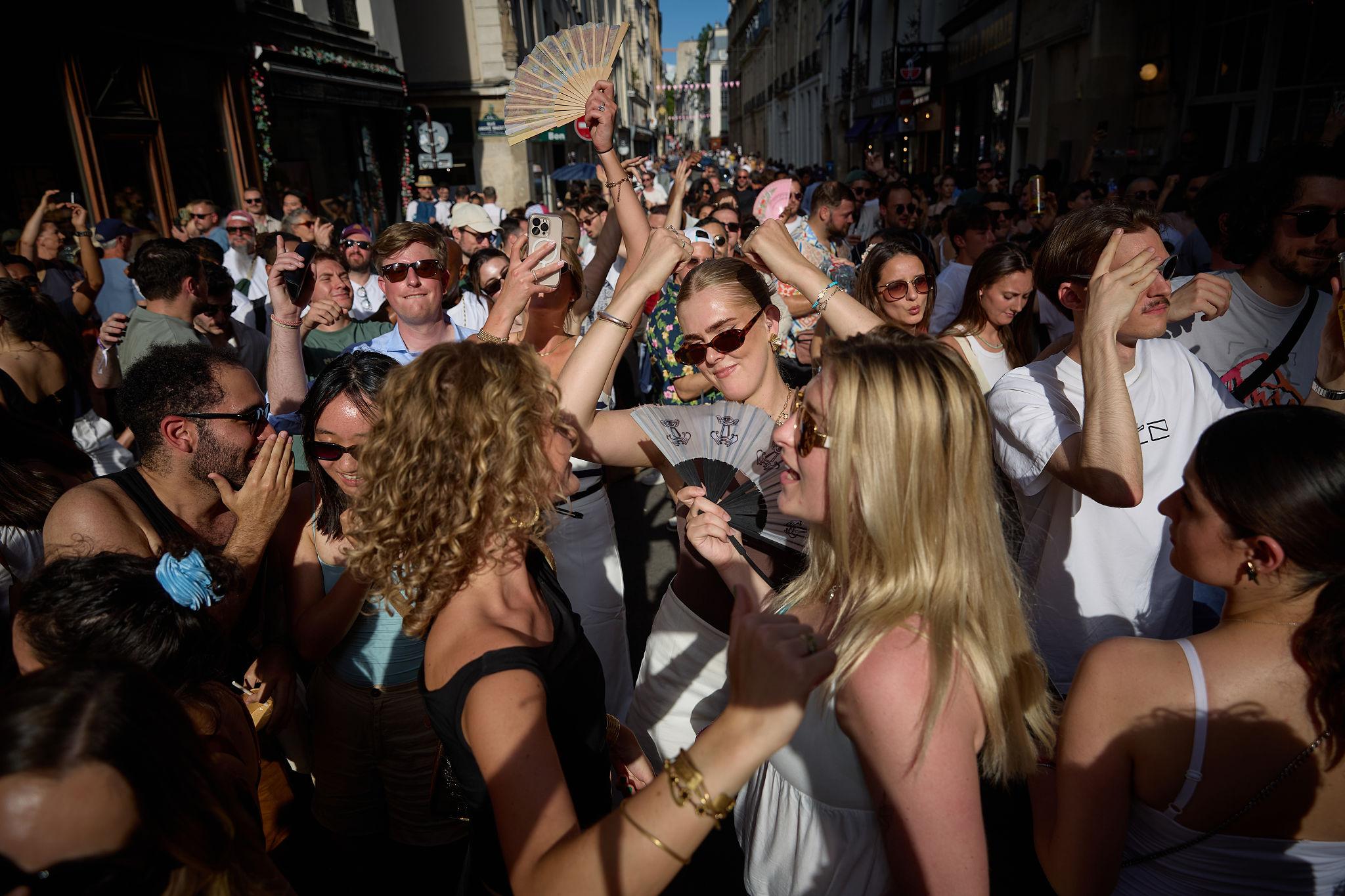 Crowds attend a street music festival during the Europe heat alert in France with emergency safety measures in place
