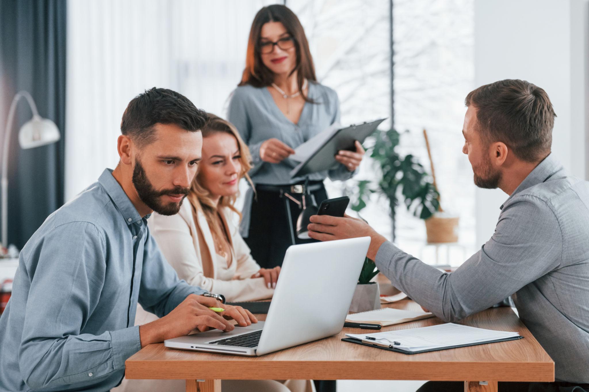 Nearly Half of Americans Fear AI Could Threaten Household Jobs, Survey Finds | Washington, D.C., 2026 1 Employees working with advanced technology as AI automation jobs reshape modern workplaces