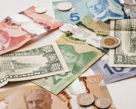 Trading screens showing Canadian dollar