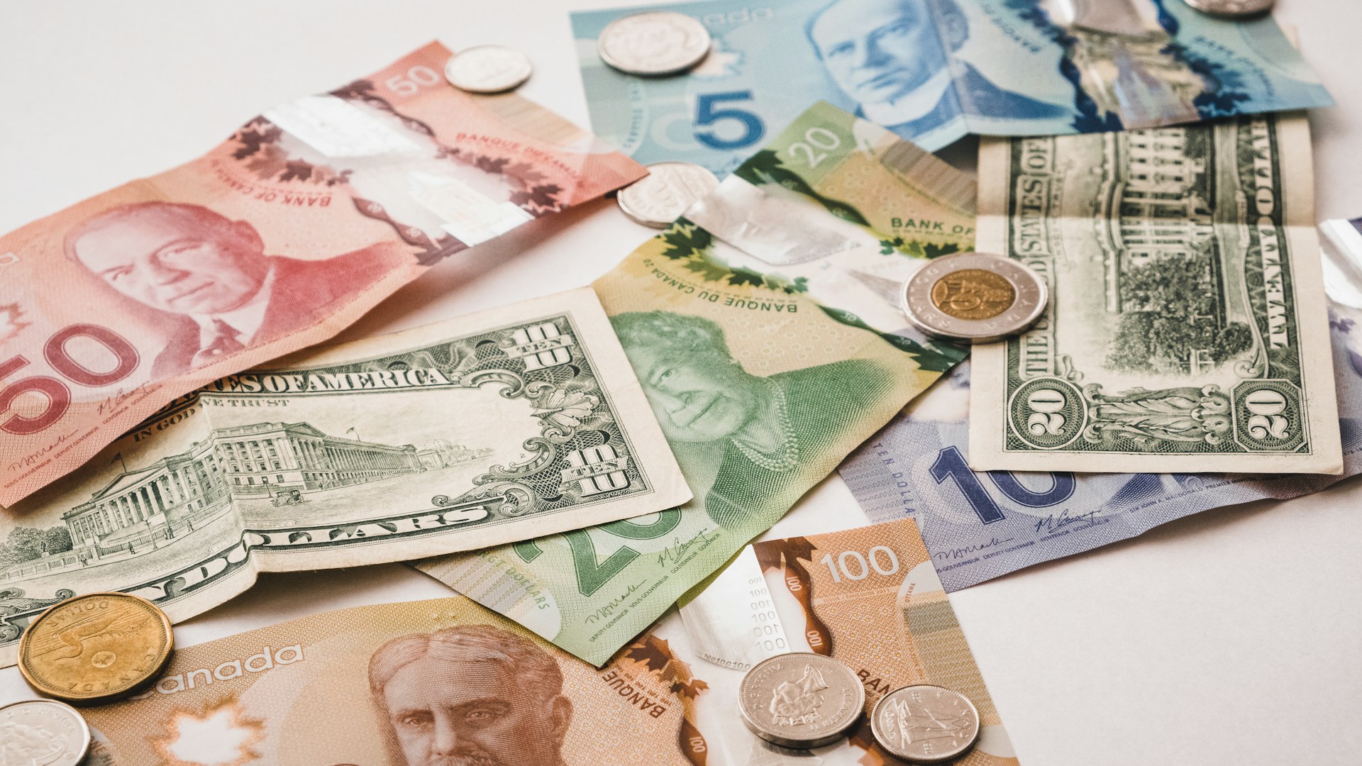 Trading screens showing Canadian dollar