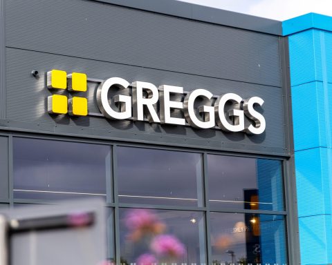 Customers outside a Greggs bakery as the retailer continues expansion amid leadership change
