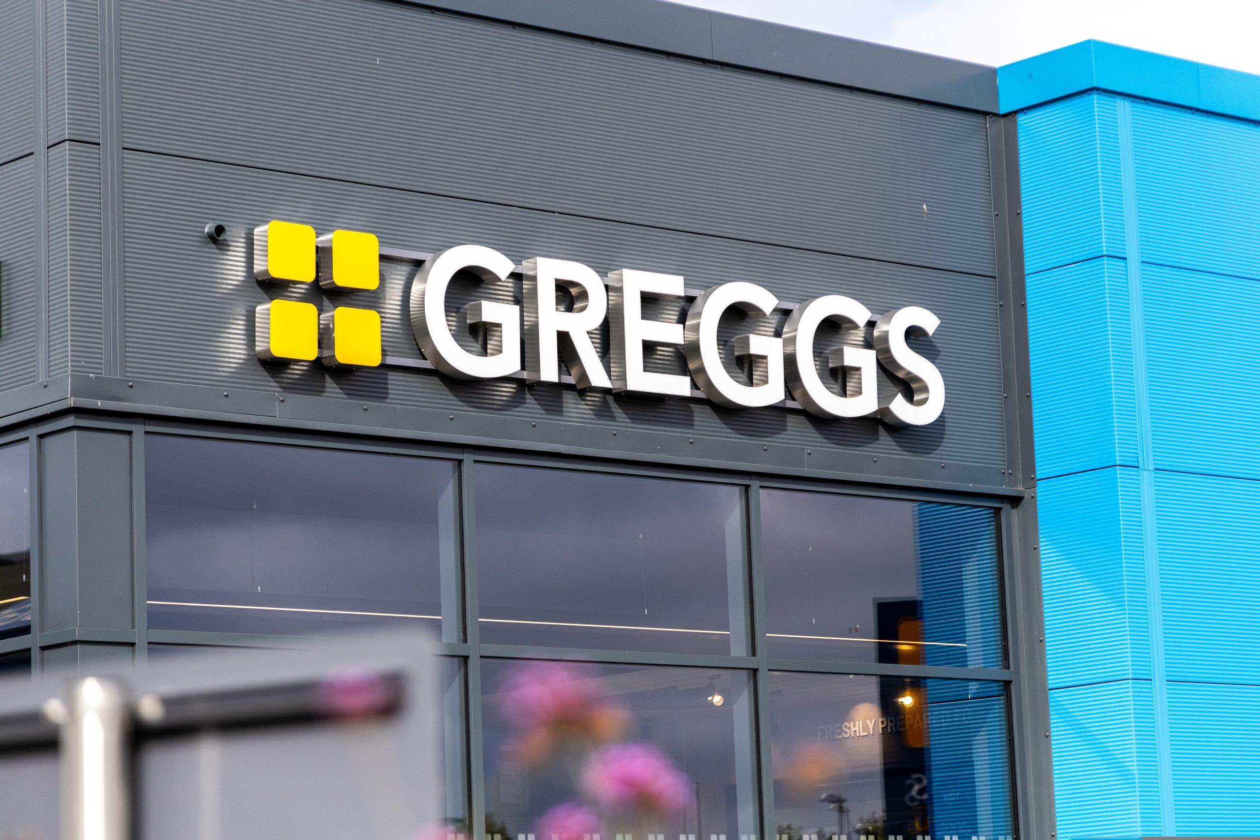 Customers outside a Greggs bakery as the retailer continues expansion amid leadership change