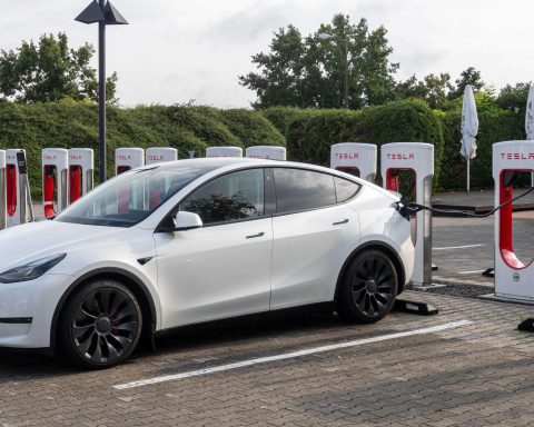 Tesla Model Y parked at a Tesla showroom highlighting Tesla market share in the European EV market