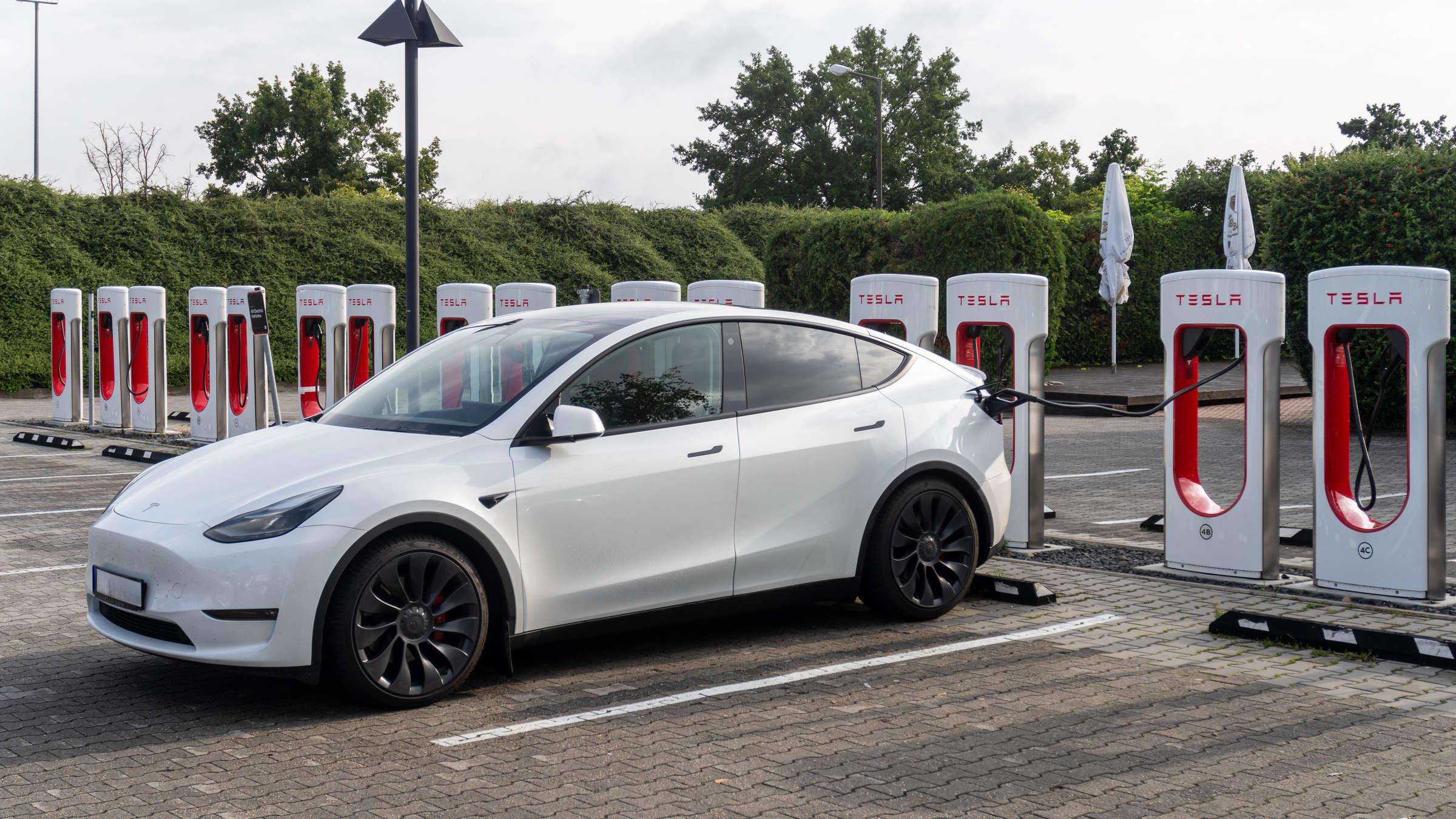 Tesla Model Y parked at a Tesla showroom highlighting Tesla market share in the European EV market