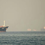 cargo ships passing through Strait of Hormuz international shipping dispute