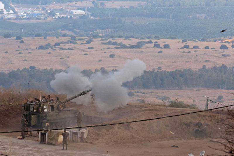 Israeli military vehicles positioned during Middle East border clashes escalation near northern frontier