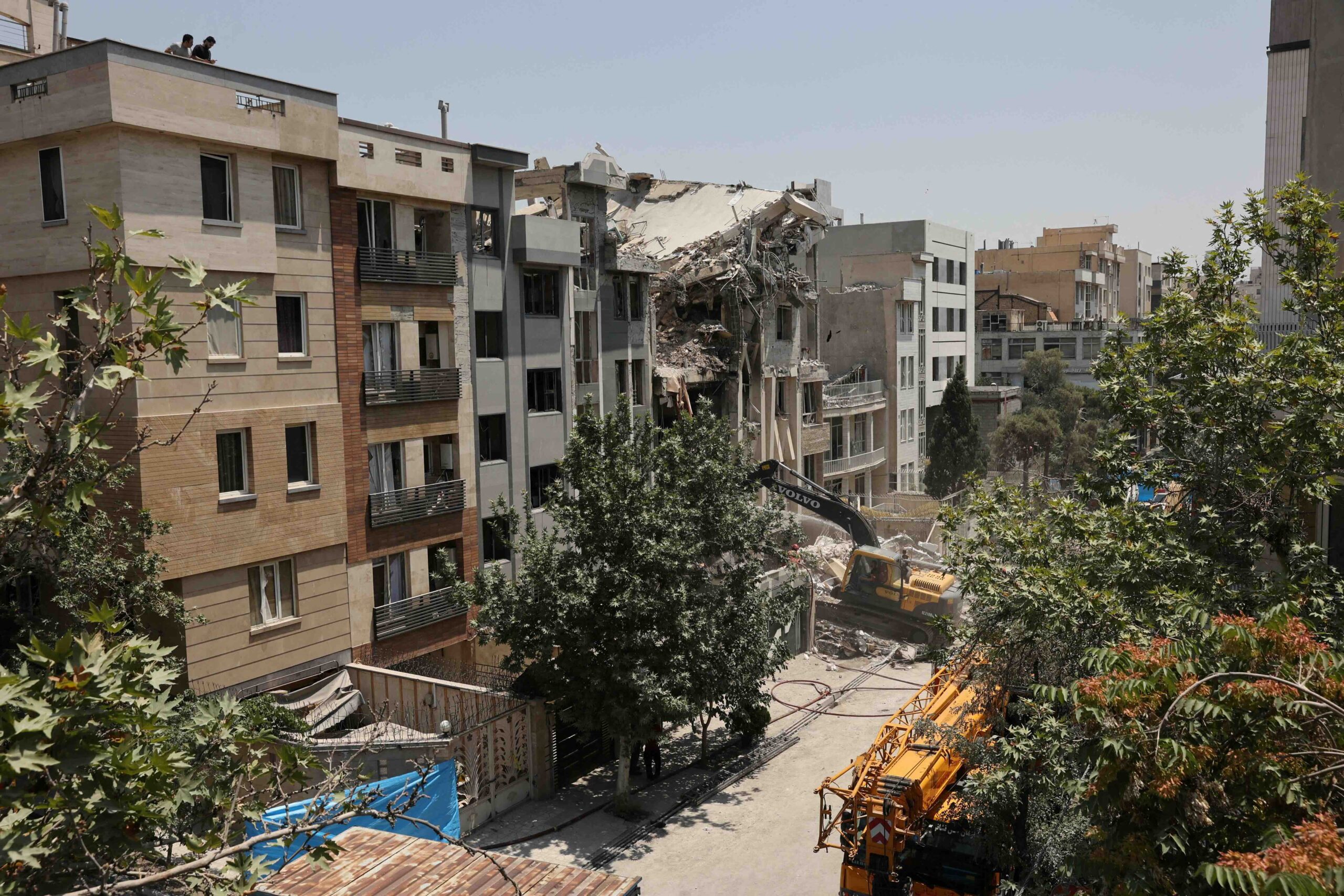 Iran humanitarian crisis deepens with destroyed apartment blocks in Tehran
