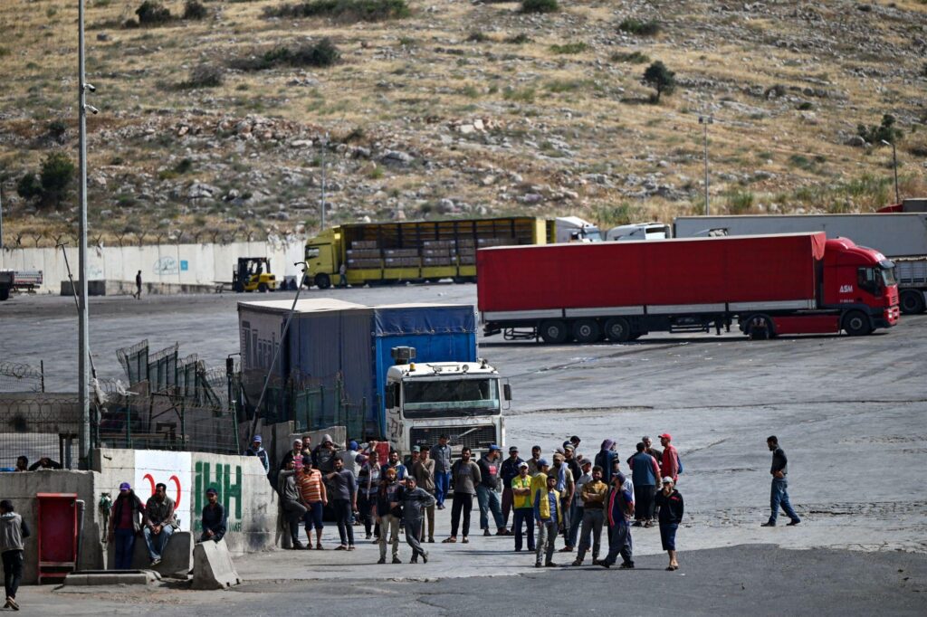Azerbaijan Iran cooperation humanitarian aid trucks delivering food and medicines to Iran border