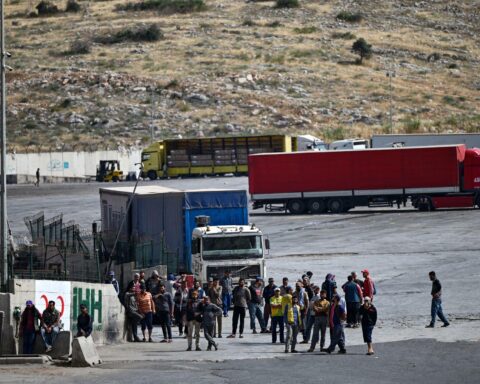 Azerbaijan Iran cooperation humanitarian aid trucks delivering food and medicines to Iran border