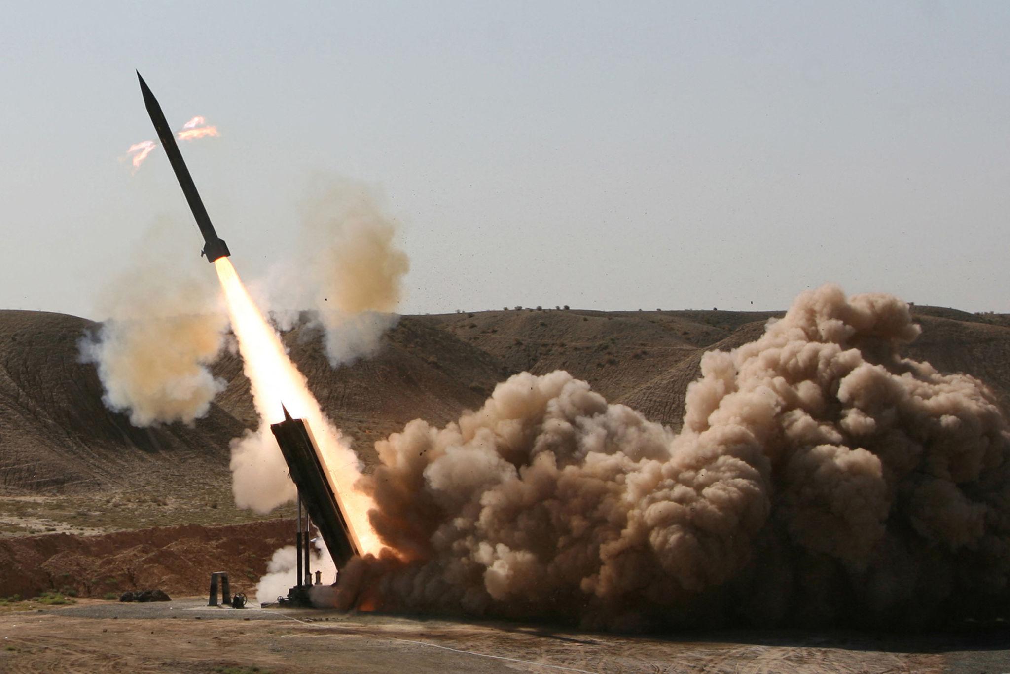 Iran missile launch plume visible above testing range during military exercise