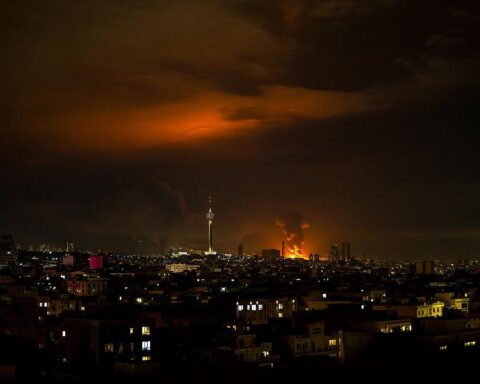 Tehran airstrikes smoke rising over buildings after nighttime attack