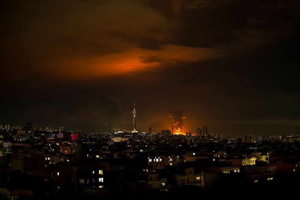 Tehran airstrikes smoke rising over buildings after nighttime attack