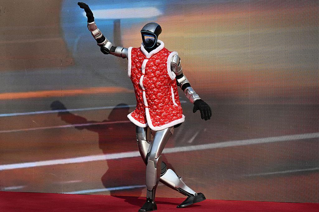 Humanoid Robot Performance Impresses Crowd Beijing 2026 3 Audience applauding humanoid robot performance during televised Lunar New Year gala in Beijing 2026