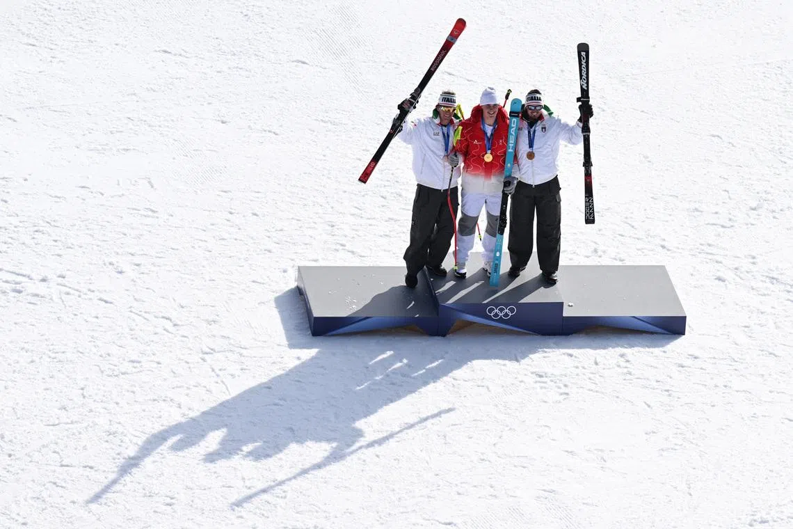 Downhill gold medal awarded at alpine skiing championship ceremony
