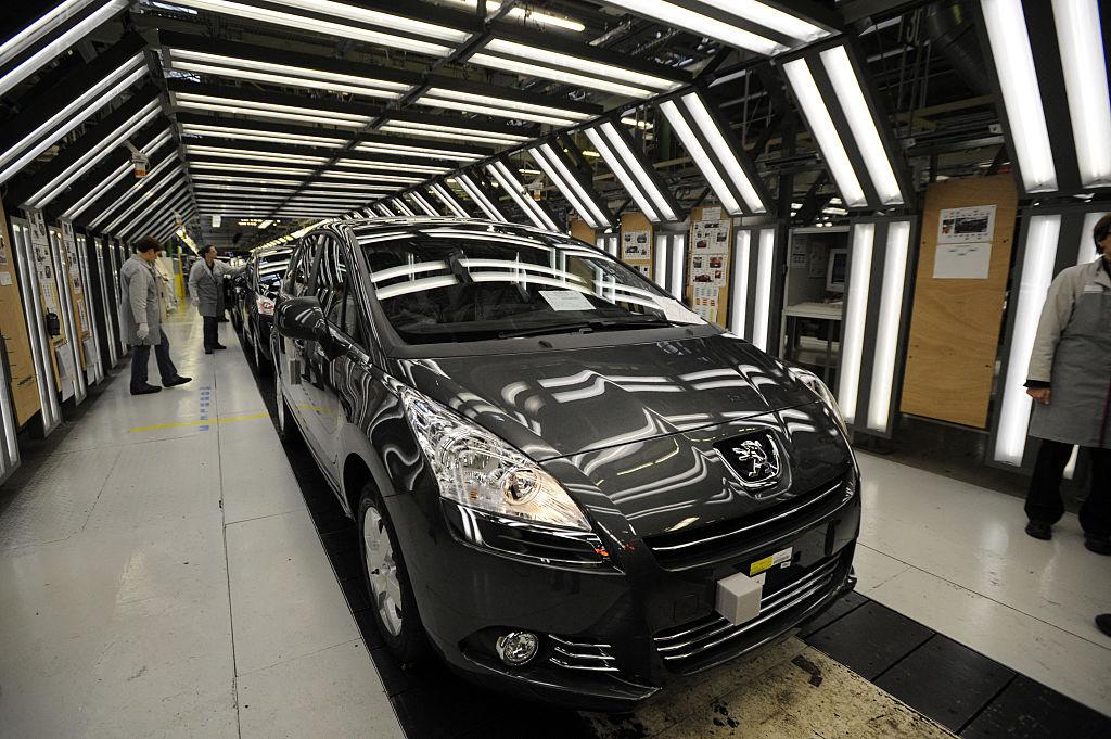 global car manufacturing shift concept with robotic automotive manufacturing technology