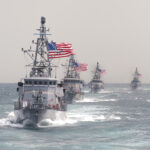 Large oil tanker moving through Persian Gulf during Strait of Hormuz shipping crisis