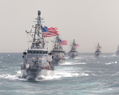 Large oil tanker moving through Persian Gulf during Strait of Hormuz shipping crisis