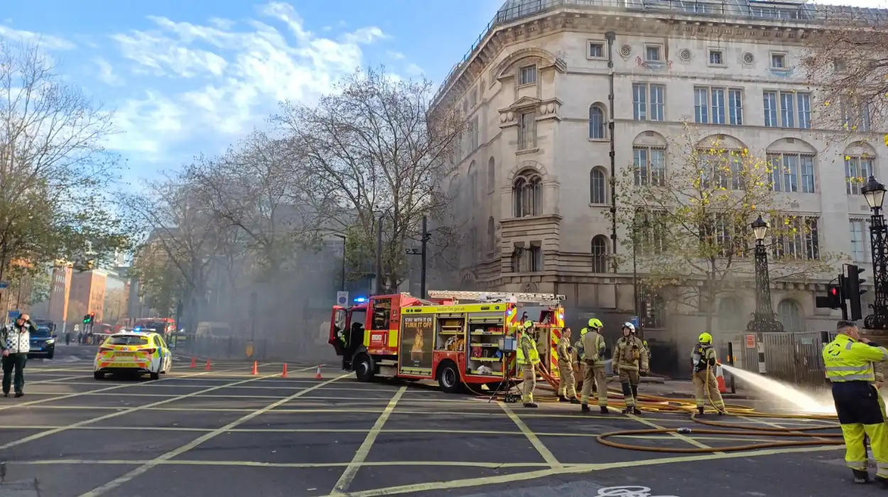 Dozens of firefighters tackle underground fire in central London