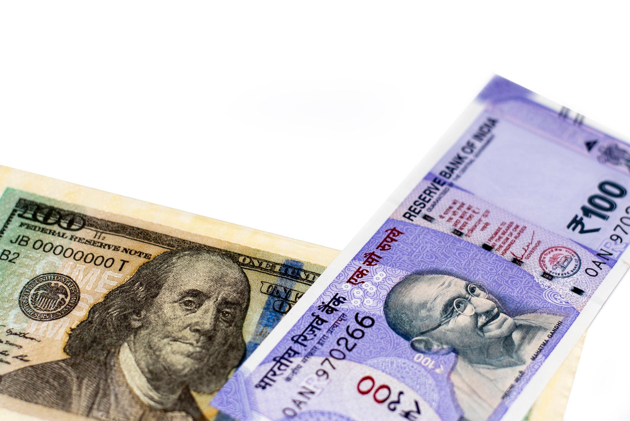 Currency traders monitoring global markets impact India in foreign exchange markets