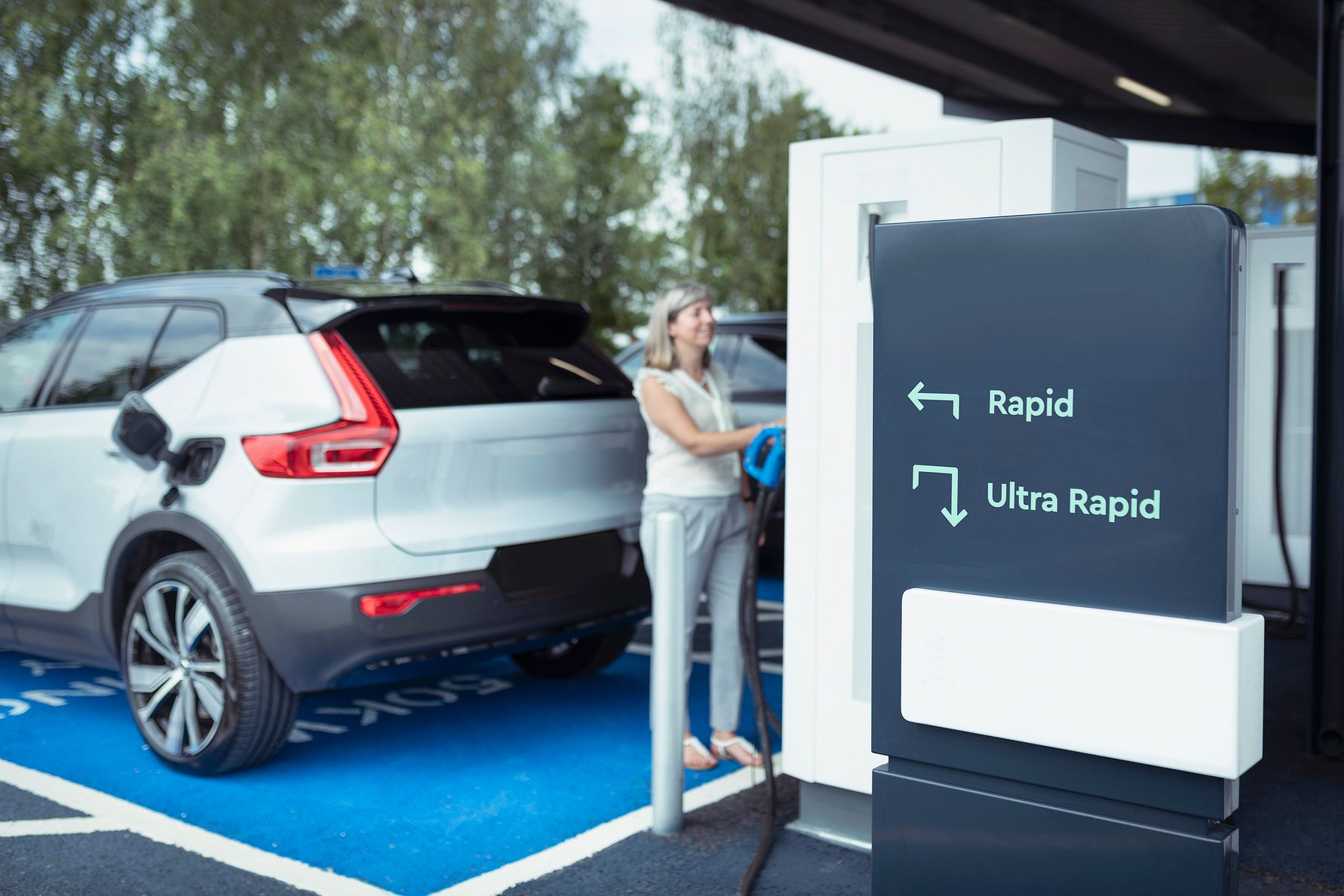 Electric vehicles UK driving through major city roads