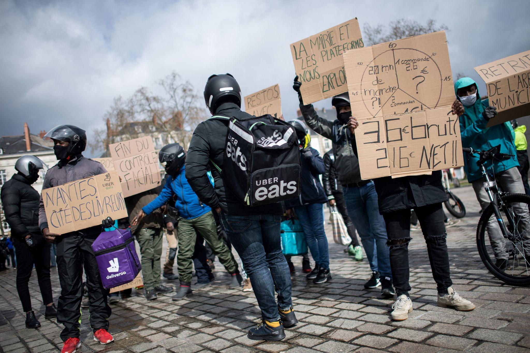 Platform Workers Rights Debate Grows in Europe 2 Uber drivers gather in Paris amid platform workers rights dispute