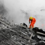 Tehran rescue operation emergency crews use heavy machinery to clear debris