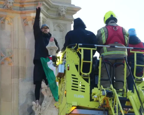 Man scales Westminster tower, negotiators intervene