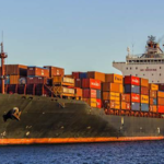 Global trade route disruption affecting cargo ships in the Strait of Hormuz