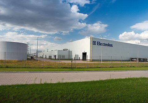 EU manufacturing jobs impact shown through idle production line after shutdown
