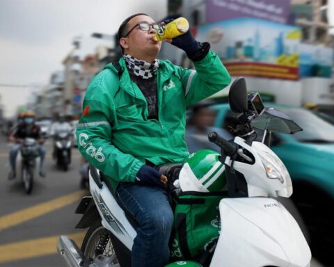 Delivery driver facing platform economy challenges due to high fuel costs in Vietnam