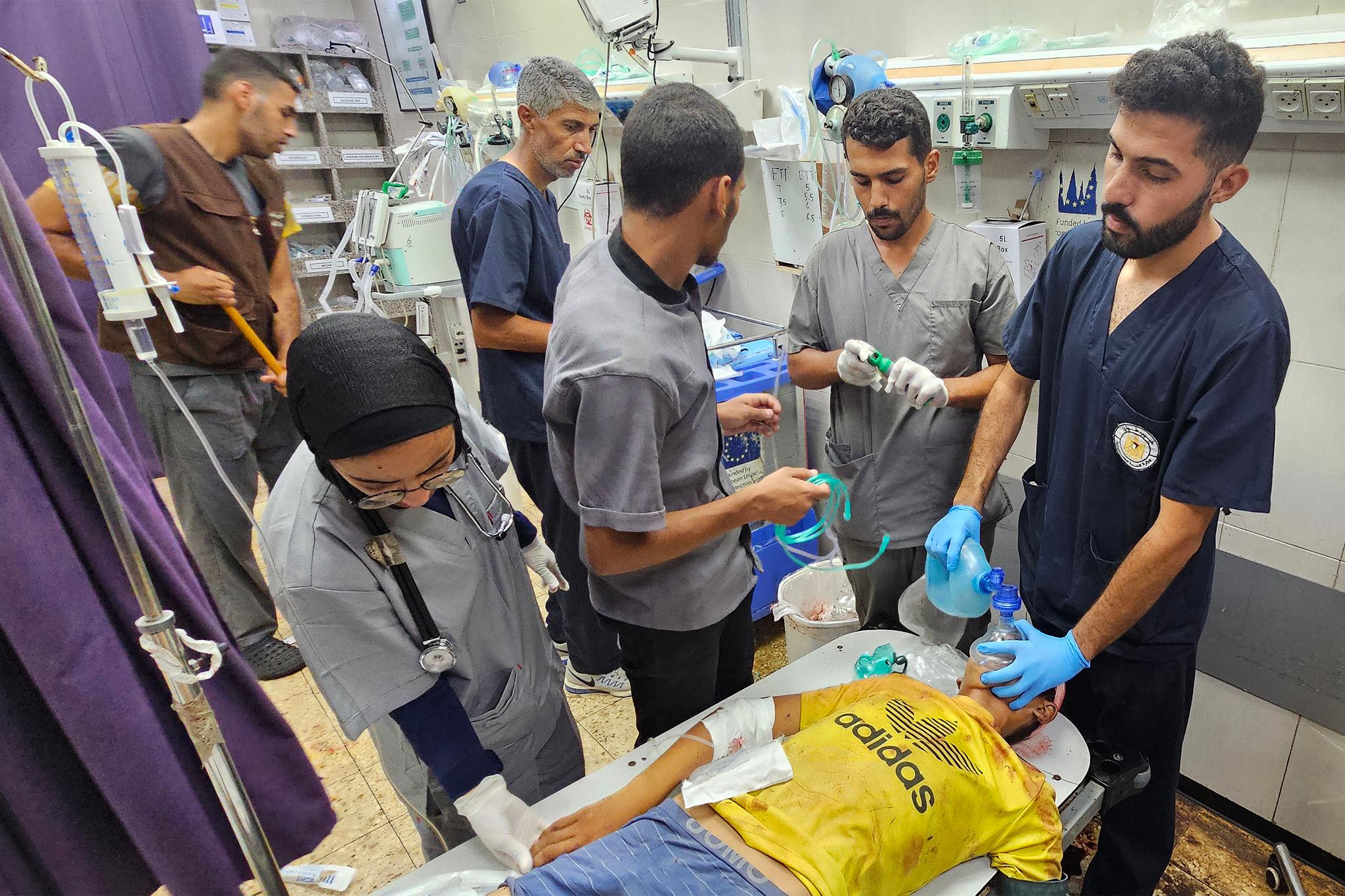 Gaza hospitals patients lying in crowded hospital corridors