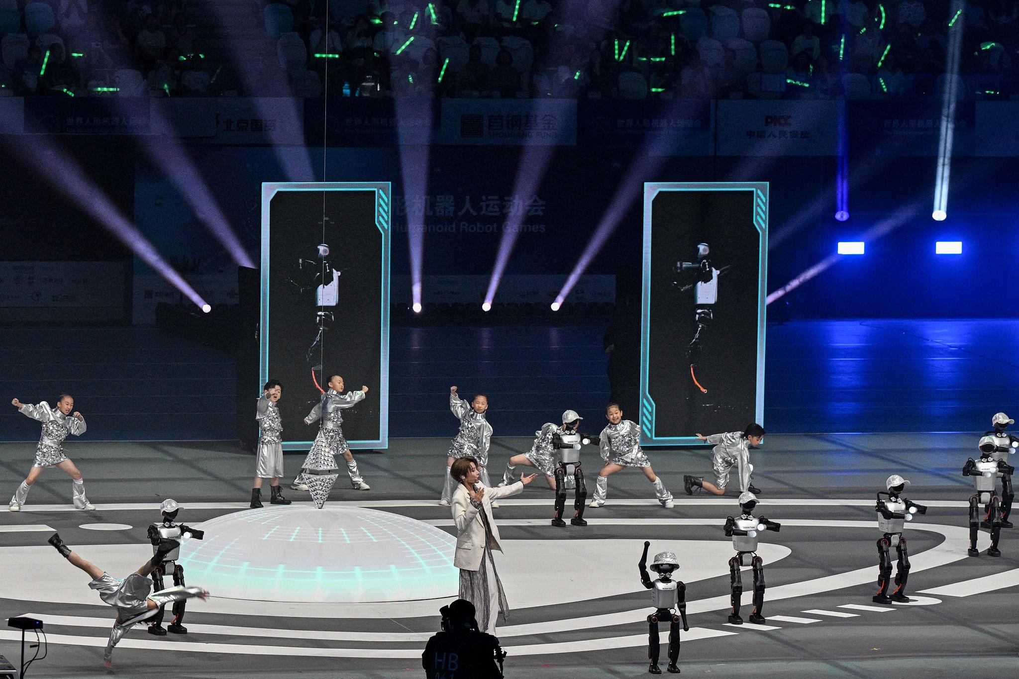 Humanoid Robot Performance Impresses Crowd Beijing 2026 1 Engineers preparing humanoid robot performance system during rehearsal in Beijing robotics laboratory 2026