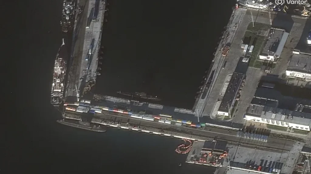 Ukraine claims attack on Russian submarine as satellite images reveal pier damage