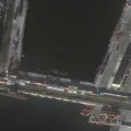Ukraine claims attack on Russian submarine as satellite images reveal pier damage