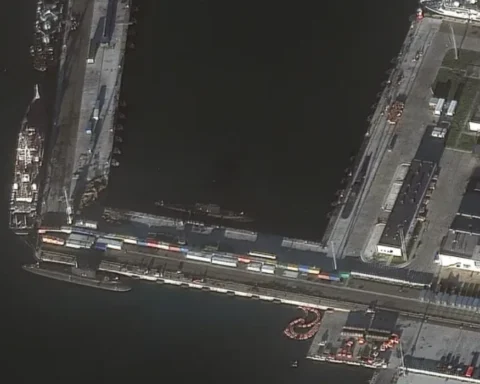 Ukraine claims attack on Russian submarine as satellite images reveal pier damage