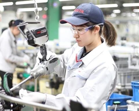 automotive profit margins pressure visible in global car manufacturing assembly line operations