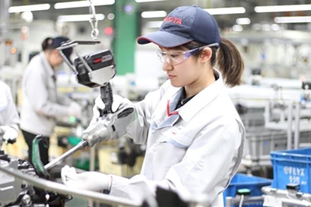 automotive profit margins pressure visible in global car manufacturing assembly line operations