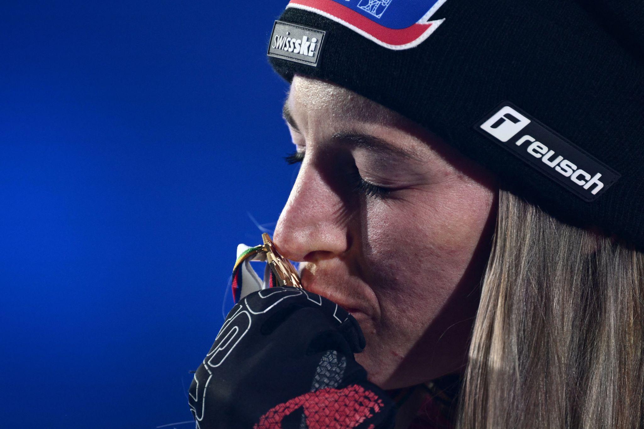 Downhill gold medal race action during alpine downhill event