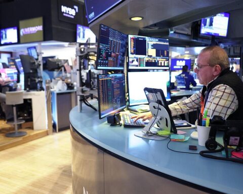 Wall Street traders reacting to US economic outlook data