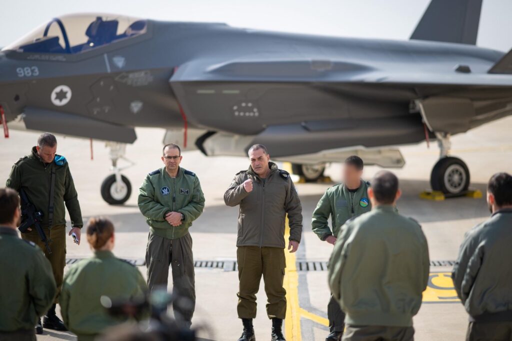 Tehran infrastructure strikes showing smoke rising over the city after airstrike
