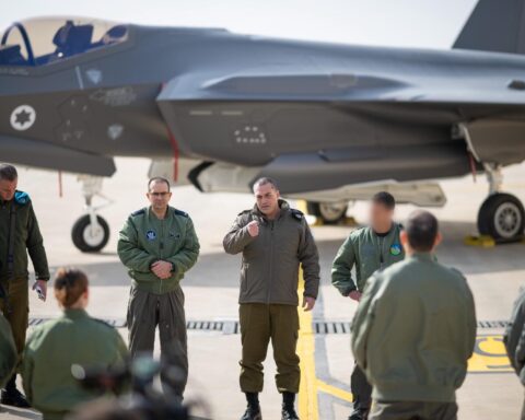 Tehran infrastructure strikes showing smoke rising over the city after airstrike