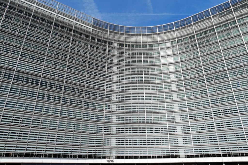 EU sanctions policy debate outside European Union headquarters in Brussels 2026