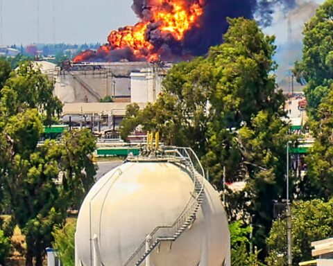Burning oil storage tank highlighting Iran oil infrastructure damage